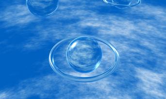 Abstract crystal spheres floating against a blue sky